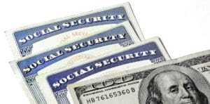 Social Security Cards Representing Finances and Retirement with Money